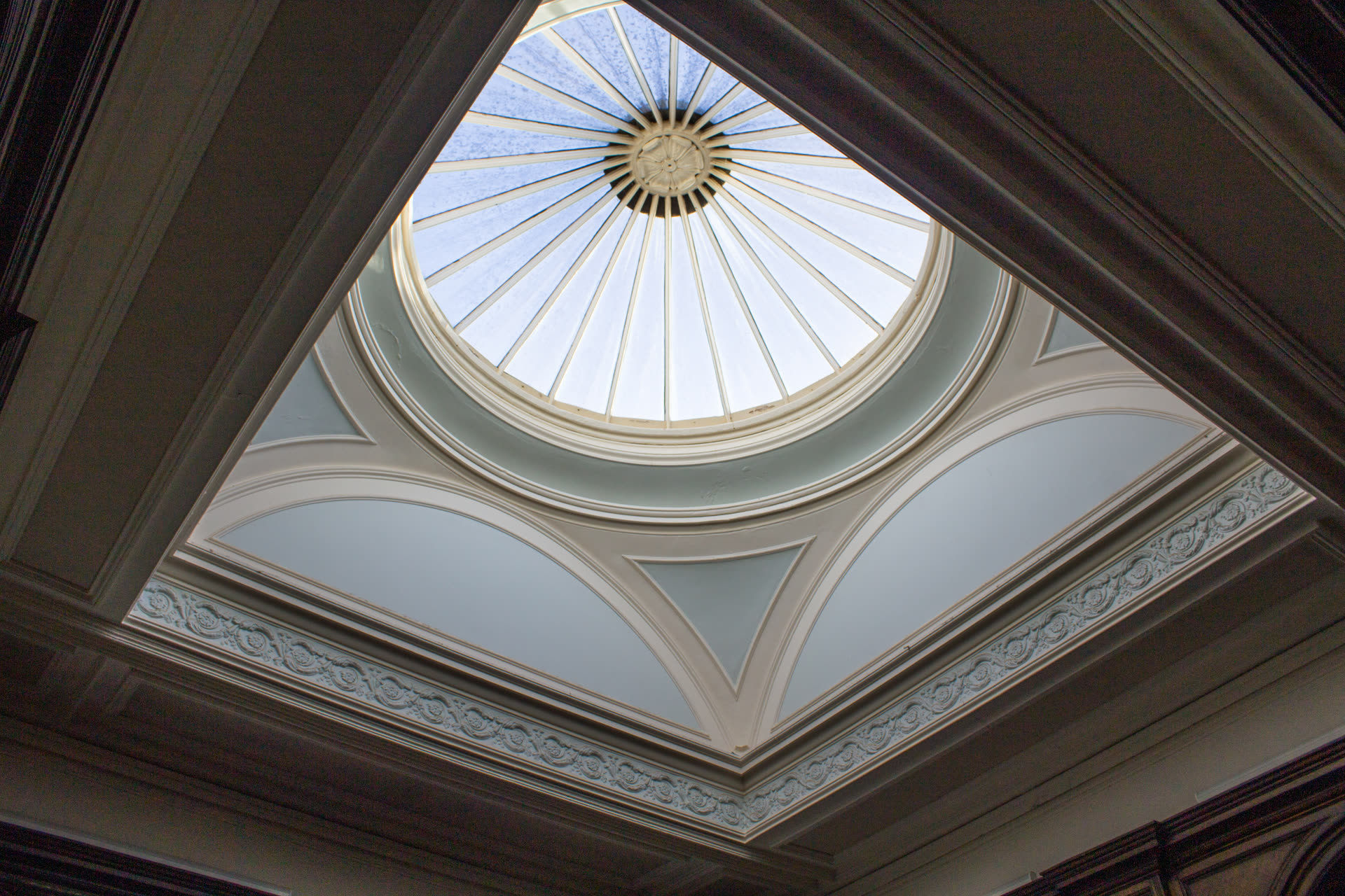 Bright skylight set into a ceiling, providing sunlight and enhancing the ambiance of the room.